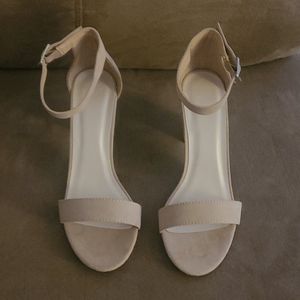 Nude open toe shoes.